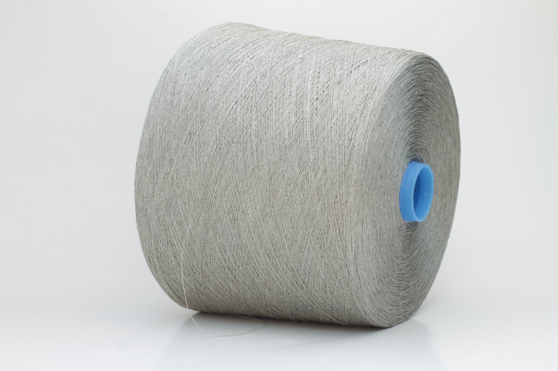 Fine, single-ply linen yarn in a rich charcoal gray. Reveals a crisp texture and subtle natural sheen, typical of pure linen fiber.