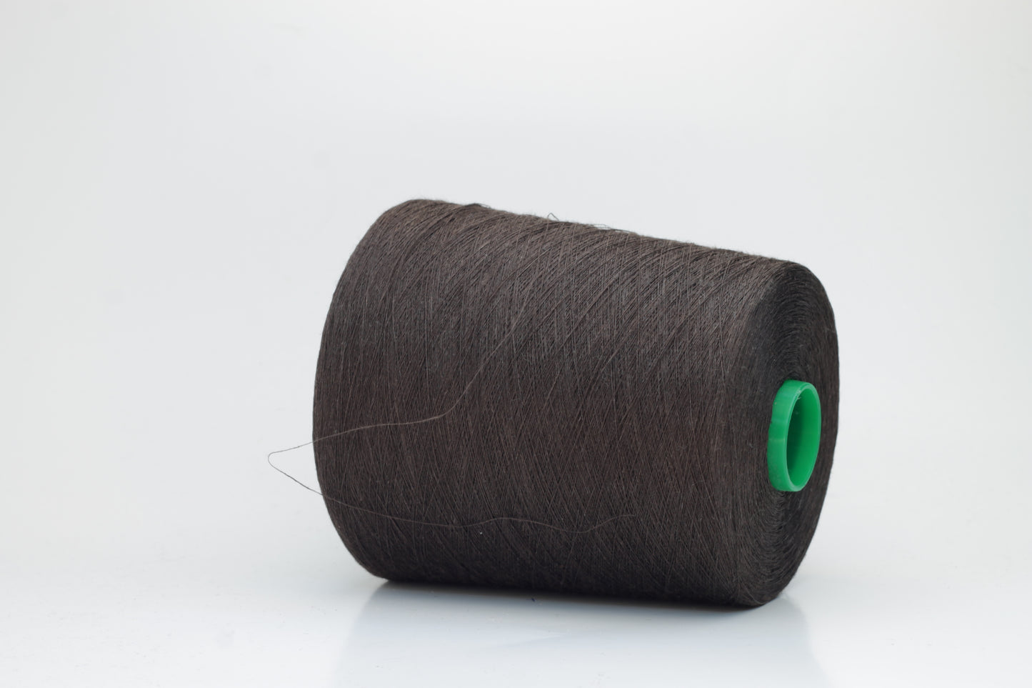 Fine, single-ply linen yarn in a rich Brown. Reveals a crisp texture and subtle natural sheen, typical of pure linen fiber.