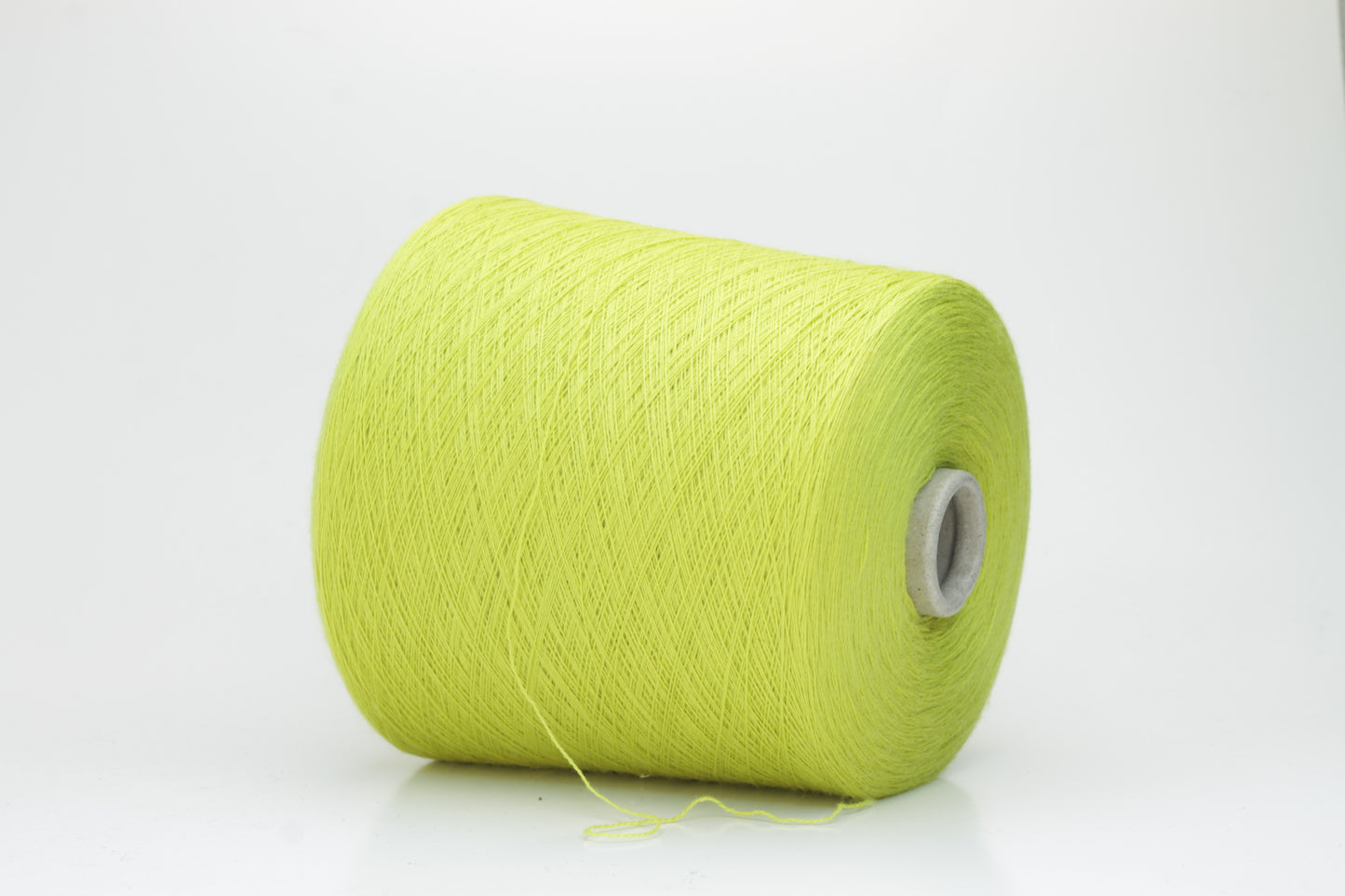 Close-up of luxurious Lime Merino wool yarn, two-ply twist with a soft, subtle sheen, and fine, consistent thread structure.