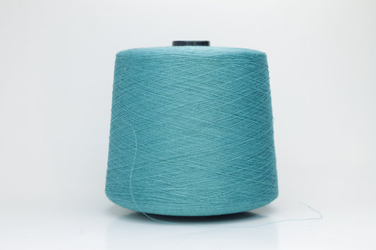Fine, single-ply linen yarn in a Turquoise. Reveals a crisp texture and subtle natural sheen, typical of pure linen fiber.
