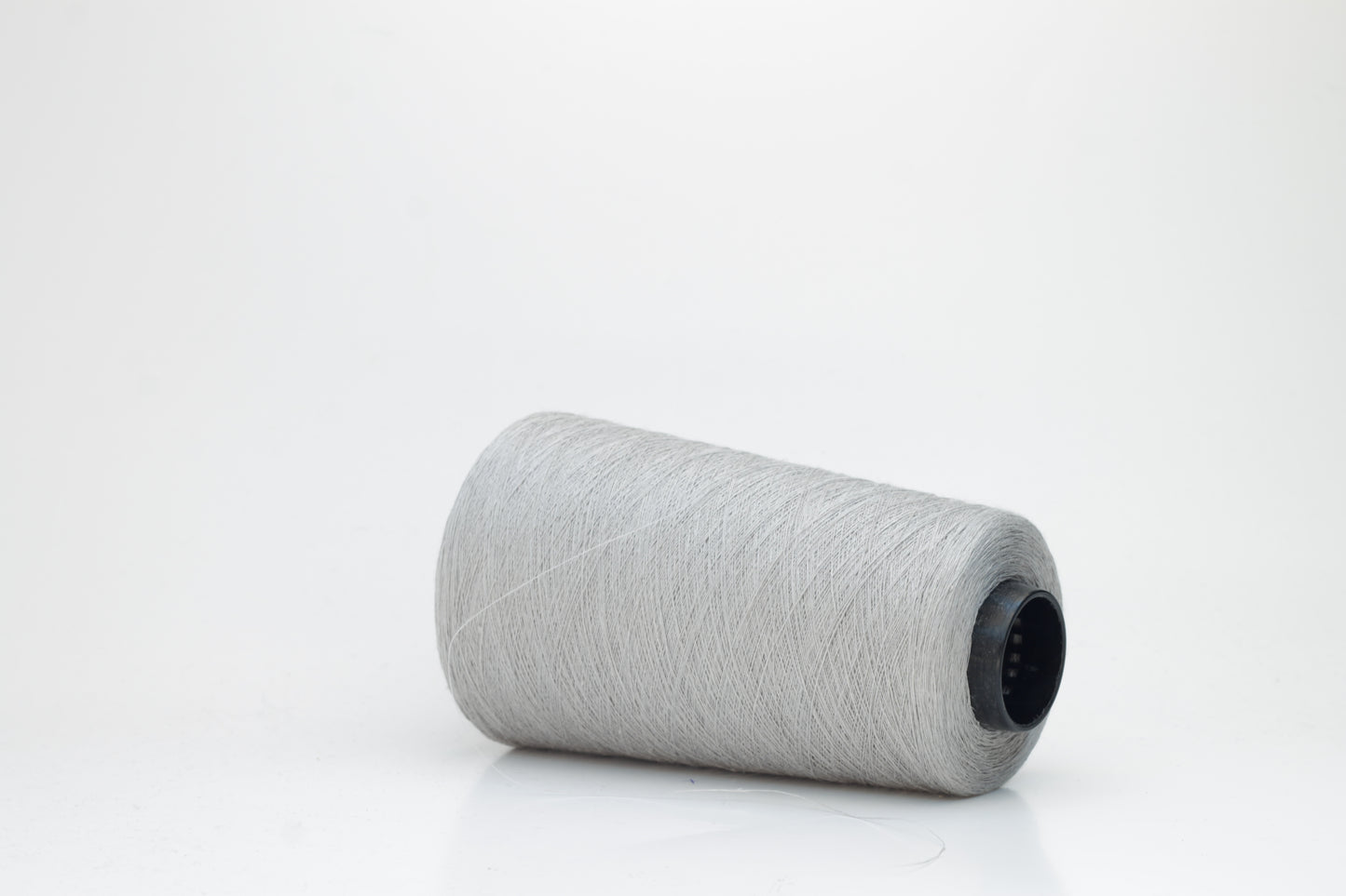 Fine, single-ply linen yarn in a rich Aluminum. Reveals a crisp texture and subtle natural sheen, typical of pure linen fiber.