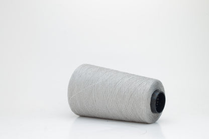 Fine, single-ply linen yarn in a rich Aluminum. Reveals a crisp texture and subtle natural sheen, typical of pure linen fiber.