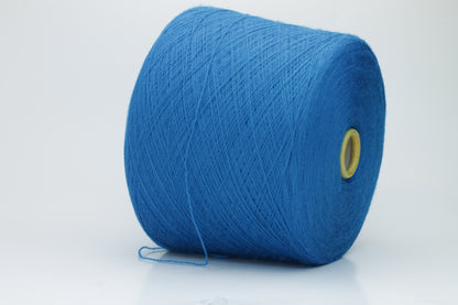 Close-up view of Zegna Baruffa Merino 100% Cashwool yarn in a deep blue hue, showcasing the twisted ply structure and subtle sheen with a fluffy texture.