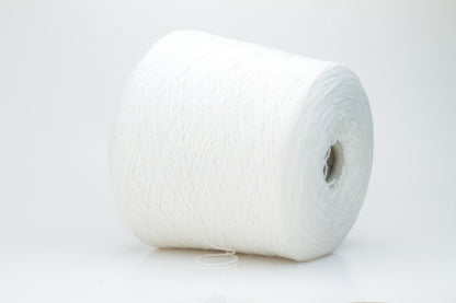Close-up of a pure white cashmere yarn skein, showcasing its soft, slightly fluffy texture and subtle sheen with a gently twisted, fine two-ply structure.