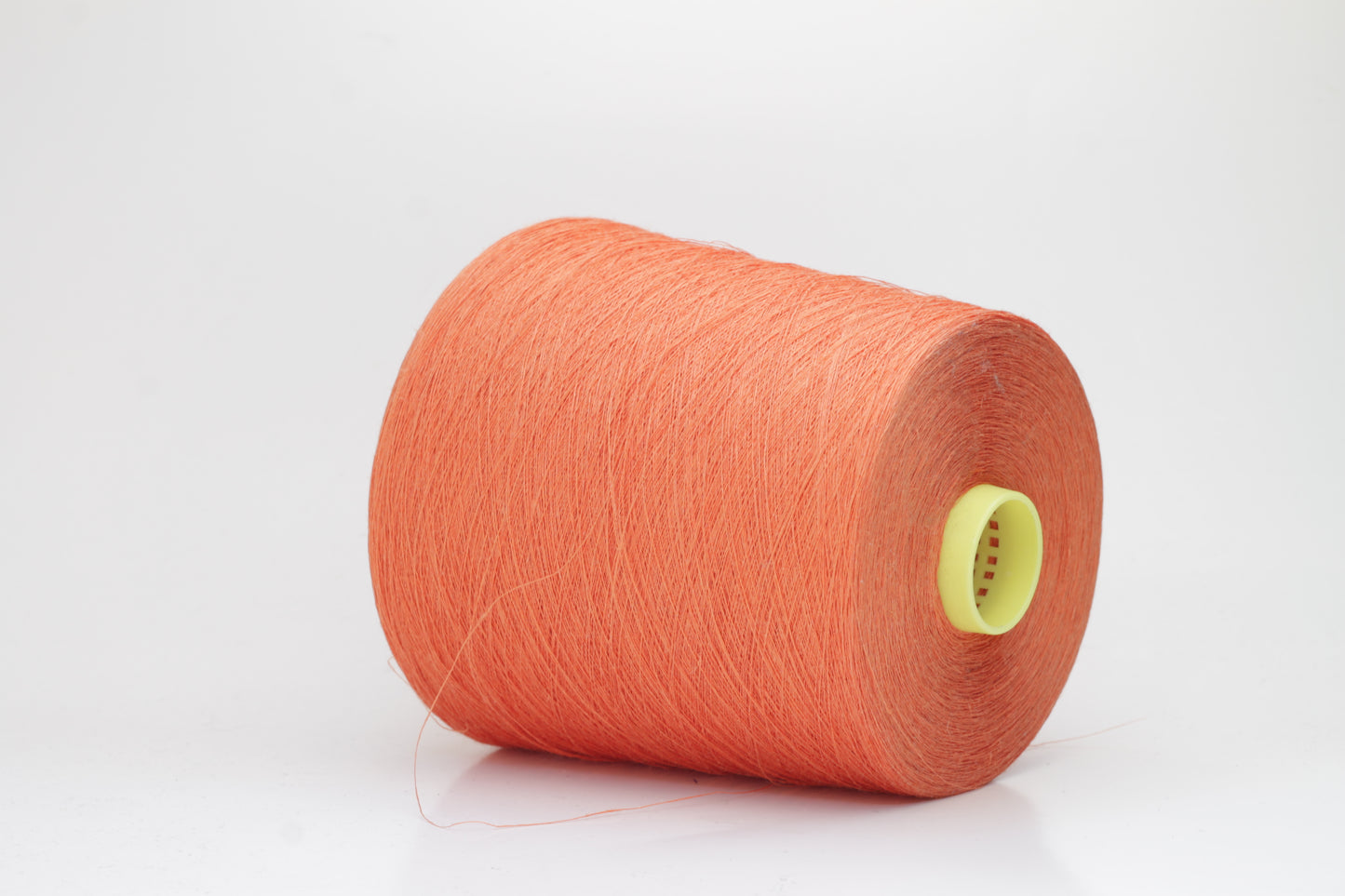 Fine, single-ply linen yarn in a rich Orange. Reveals a crisp texture and subtle natural sheen, typical of pure linen fiber.