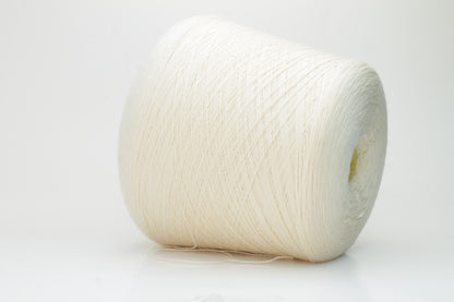 Close-up view of Zegna Baruffa Merino 100% Cashwool yarn in Milk Color. The yarn features a tight, even ply twist with visible thread structure, creating a subtle sheen and fluffy texture – perfect for intricate knitting designs.