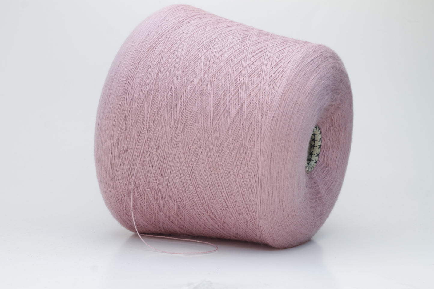 Close-up studio shot showcasing the 'Harmony 2' merino yarn in a rich 'Rosa' hue. The yarn exhibits a tight, twisted ply with an even thread structure, creating subtle sheen and a fluffy texture.
