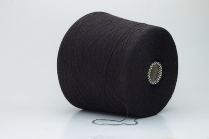 Close-up of a two-ply dark brown cashmere yarn, softly twisted with a subtle sheen, displaying its deep rich hue and delicate fuzziness, ready for luxury crafting.