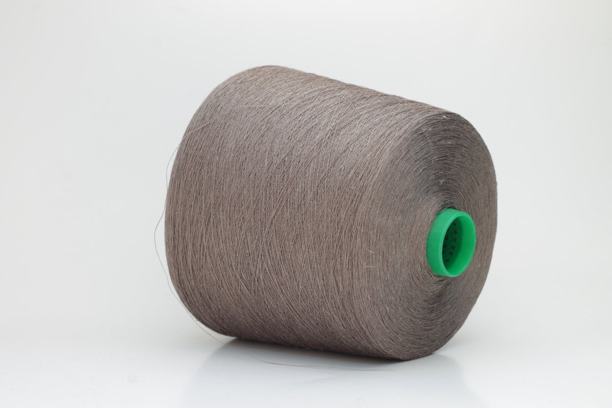 Fine, single-ply linen yarn in a rich Talpa. Reveals a crisp texture and subtle natural sheen, typical of pure linen fiber.