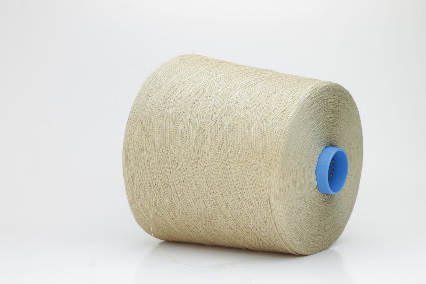 Fine, single-ply linen yarn in a rich Oatmeal. Reveals a crisp texture and subtle natural sheen, typical of pure linen fiber.