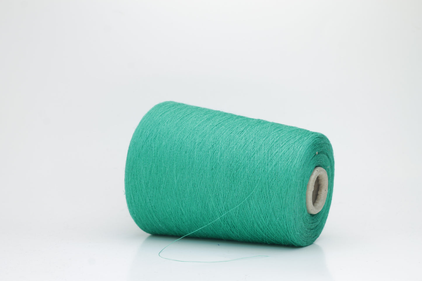 Fine, single-ply linen yarn in a rich Green. Reveals a crisp texture and subtle natural sheen, typical of pure linen fiber.