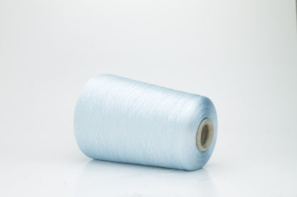 Fine, smooth, two-ply silk yarn in a vibrant sky blue. It exhibits a subtle sheen and a uniform, tight twist, reflecting light beautifully.