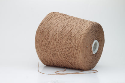 Close-up shot of luxurious Silk Bourette 100% Yarn in Mousse color. The yarn features a delicate, fine ply twist with an exceptionally smooth texture and subtle sheen, showcasing its fluffy softness.