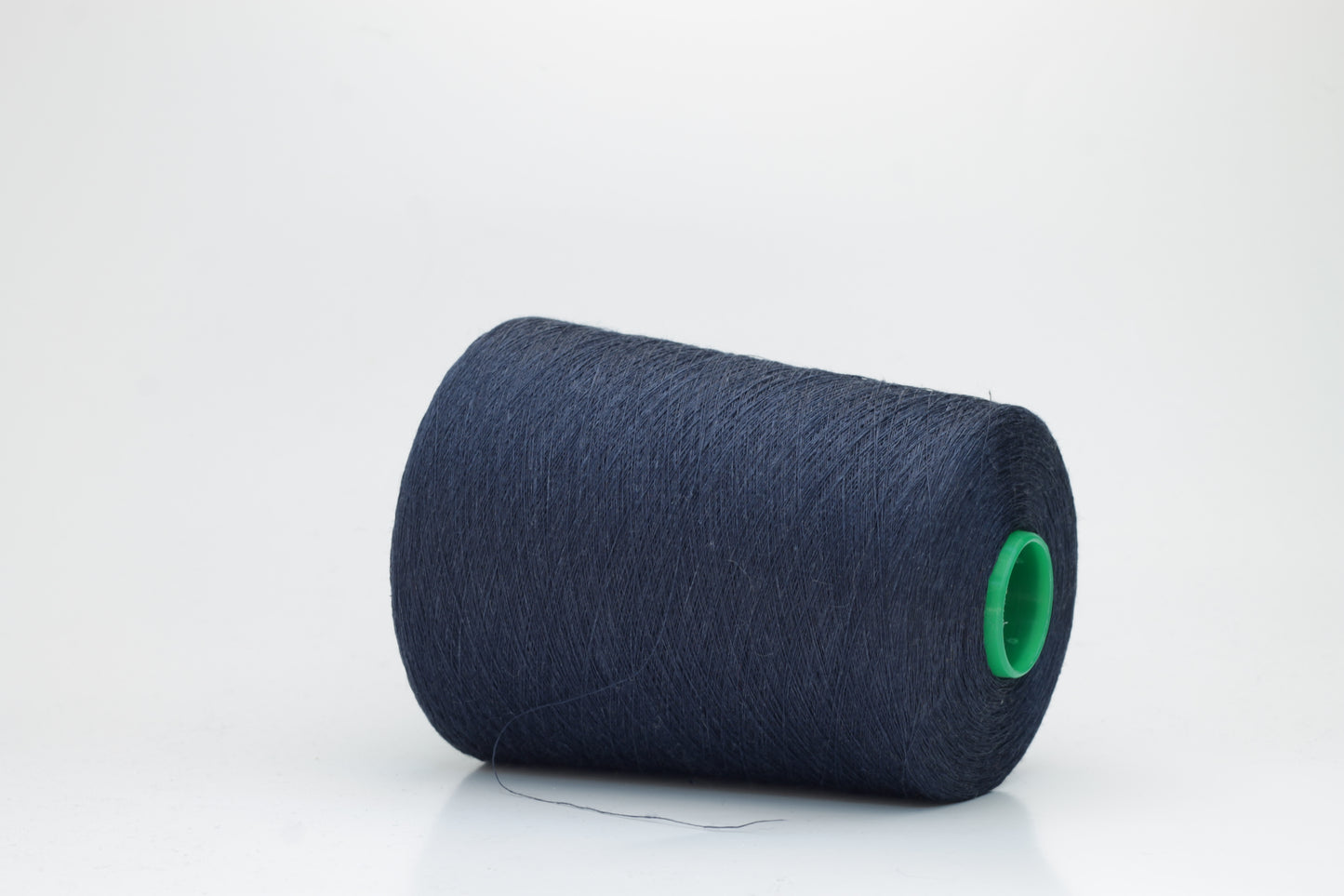 Fine, single-ply linen yarn in a rich Marina. Reveals a crisp texture and subtle natural sheen, typical of pure linen fiber.