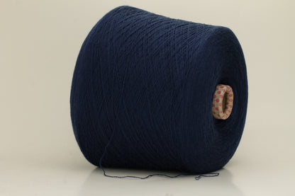 Close-up of a luxurious, soft dark blue 2-ply cashmere yarn, subtly twisted with a delicate sheen and rich, deep color saturation.