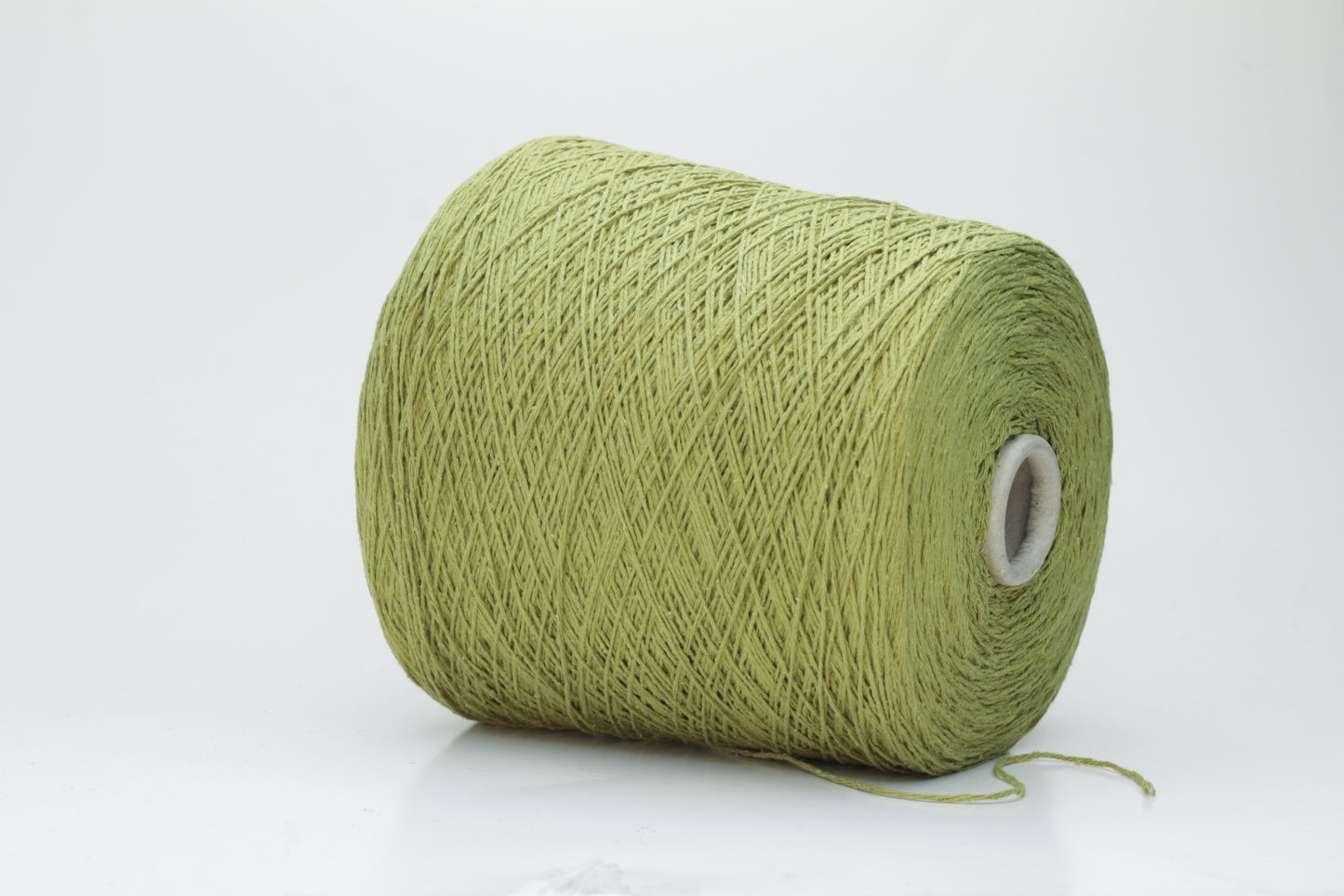 Close-up view of the Silk Bourette 100% yarn in Olive color, showcasing its exceptionally fine ply twist and soft sheen – a luxurious texture perfect for knitting or weaving.