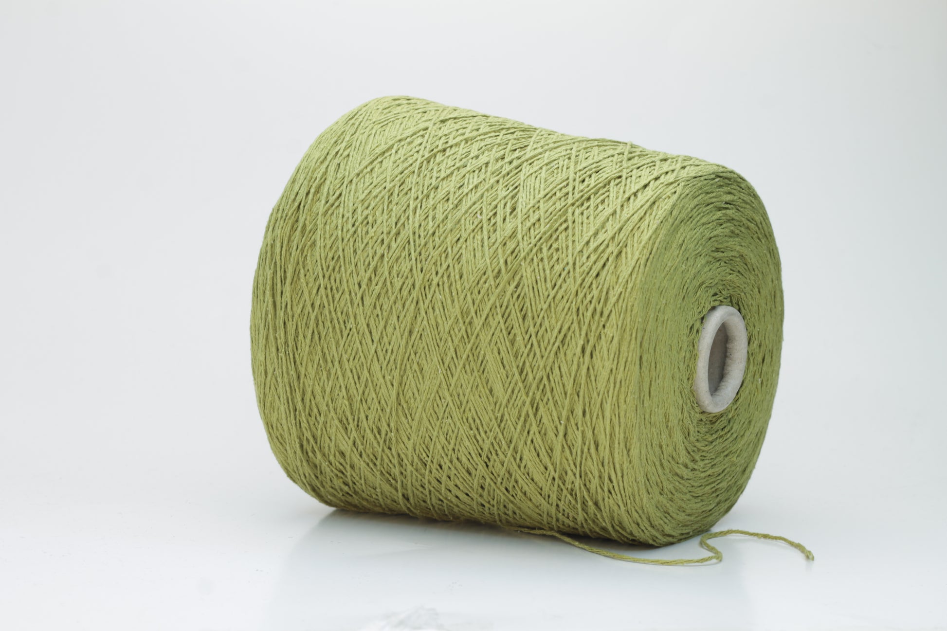 Close-up view of the Silk Bourette 100% yarn in Olive color, showcasing its exceptionally fine ply twist and soft sheen – a luxurious texture perfect for knitting or weaving.