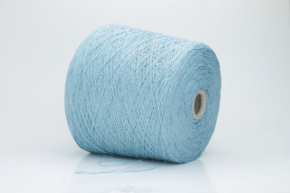 Close-up shot showcasing the shimmering, fluffy texture of the Coscata Silk Bourette yarn, with visible ply twists and a subtle sheen, highlighting its luxurious feel.