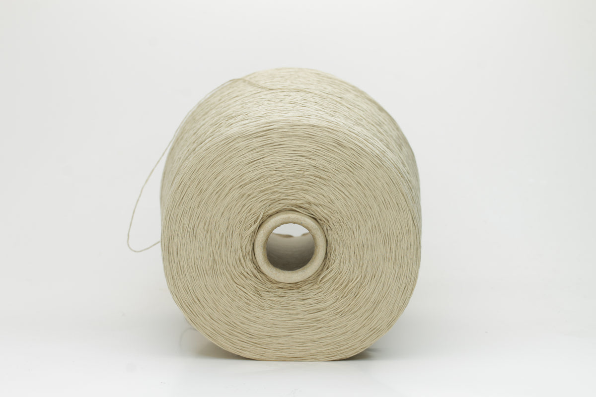 A soft, matte-finish yarn in a delicate light khaki beige, consisting of four finely twisted plies, offering a smooth, even texture.