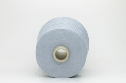 Close-up of pale frost blue 100% cotton yarn, exhibiting a tightly spun 4-ply structure with a soft, uniform sheen and smooth texture.