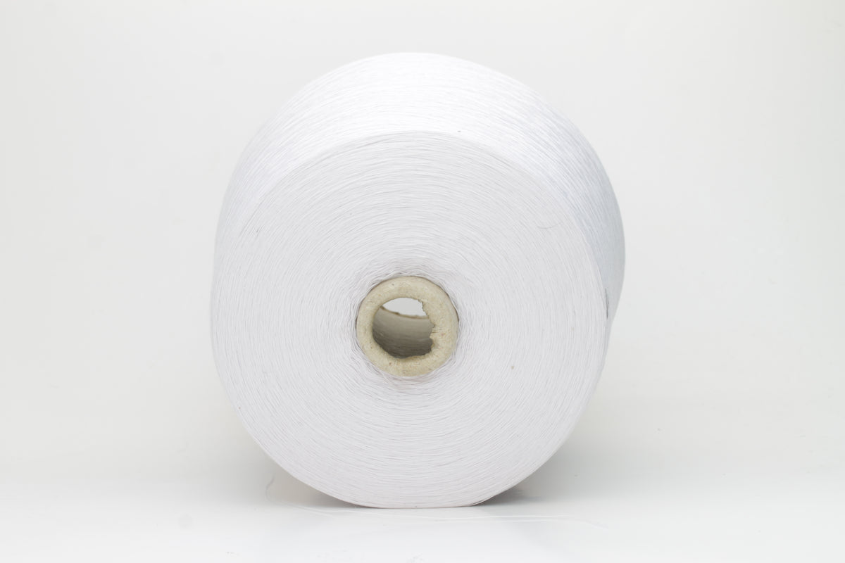 Close-up of a spool of pure white, smooth, 4-ply 100% cotton yarn with an even twist and soft matte finish, ready for textile projects.