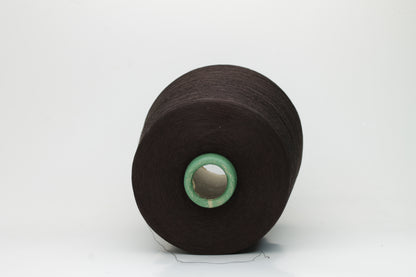 Close-up of smooth, dark Bitter Chocolate cotton yarn, tightly plied for a refined, lustrous finish. Shows even twist and deep, rich color.