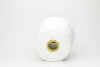 Close-up of a pristine white, single-ply cotton yarn with a smooth, even texture and subtle matte sheen, gently coiled.