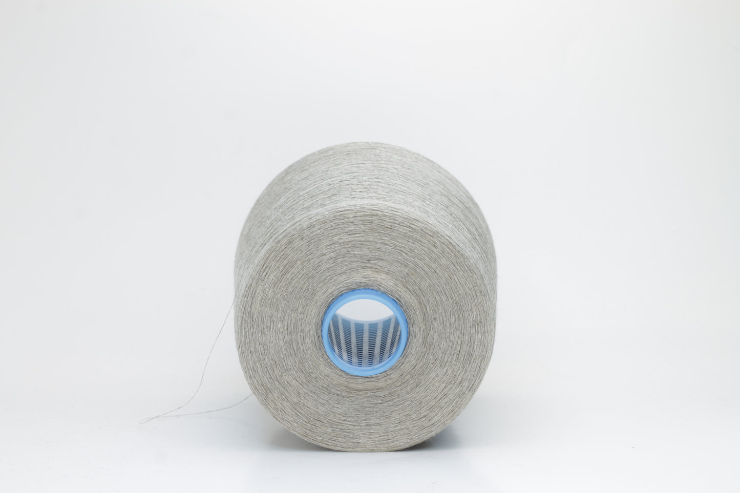 Fine, single-ply linen yarn in a Natural. Reveals a crisp texture and subtle natural sheen, typical of pure linen fiber.