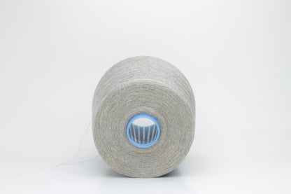 Fine, single-ply linen yarn in a Natural. Reveals a crisp texture and subtle natural sheen, typical of pure linen fiber.