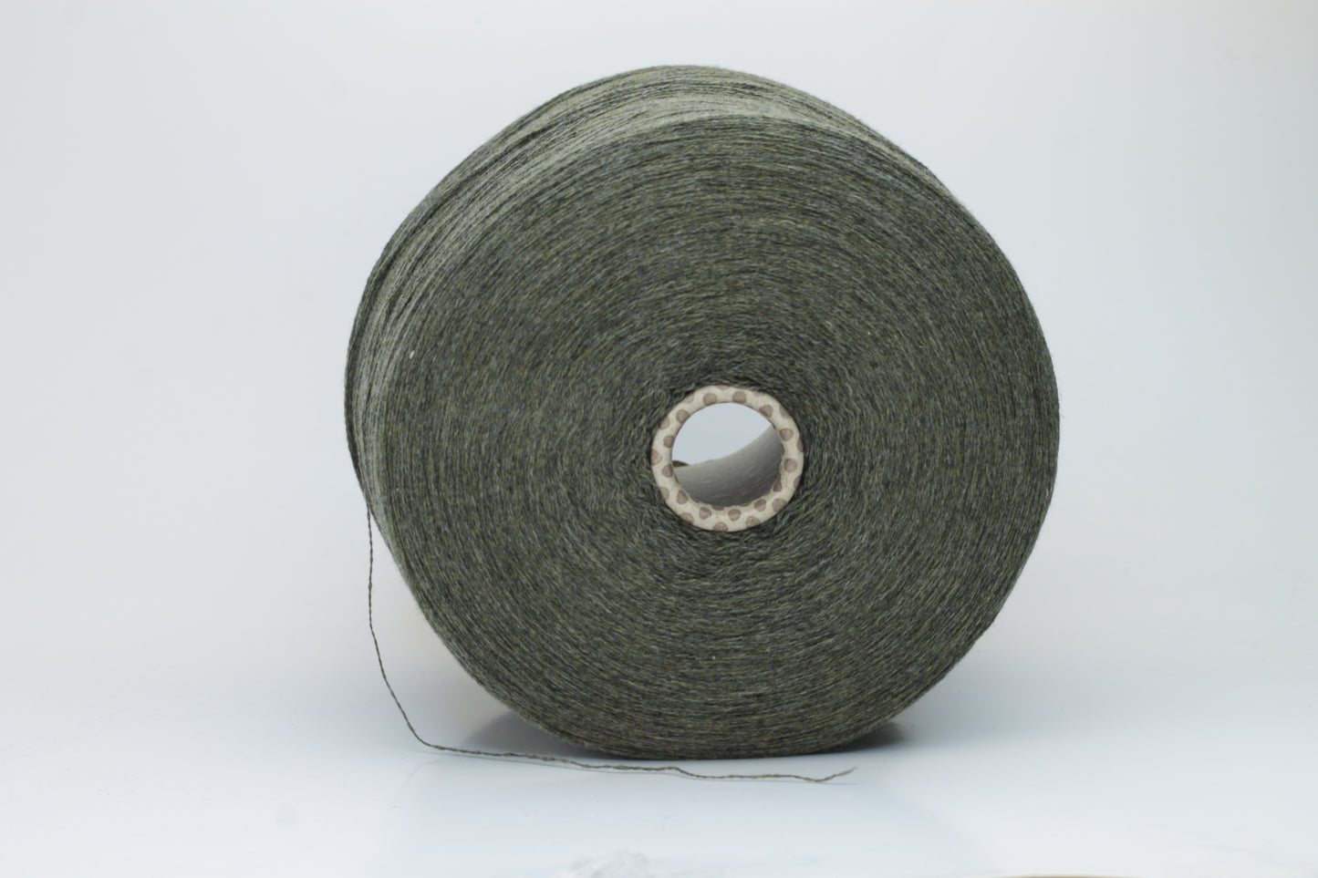 Close-up of a skein of luxurious 100% cashmere yarn in a deep Borneo brown, showcasing its soft, slightly matte sheen and subtle halo.