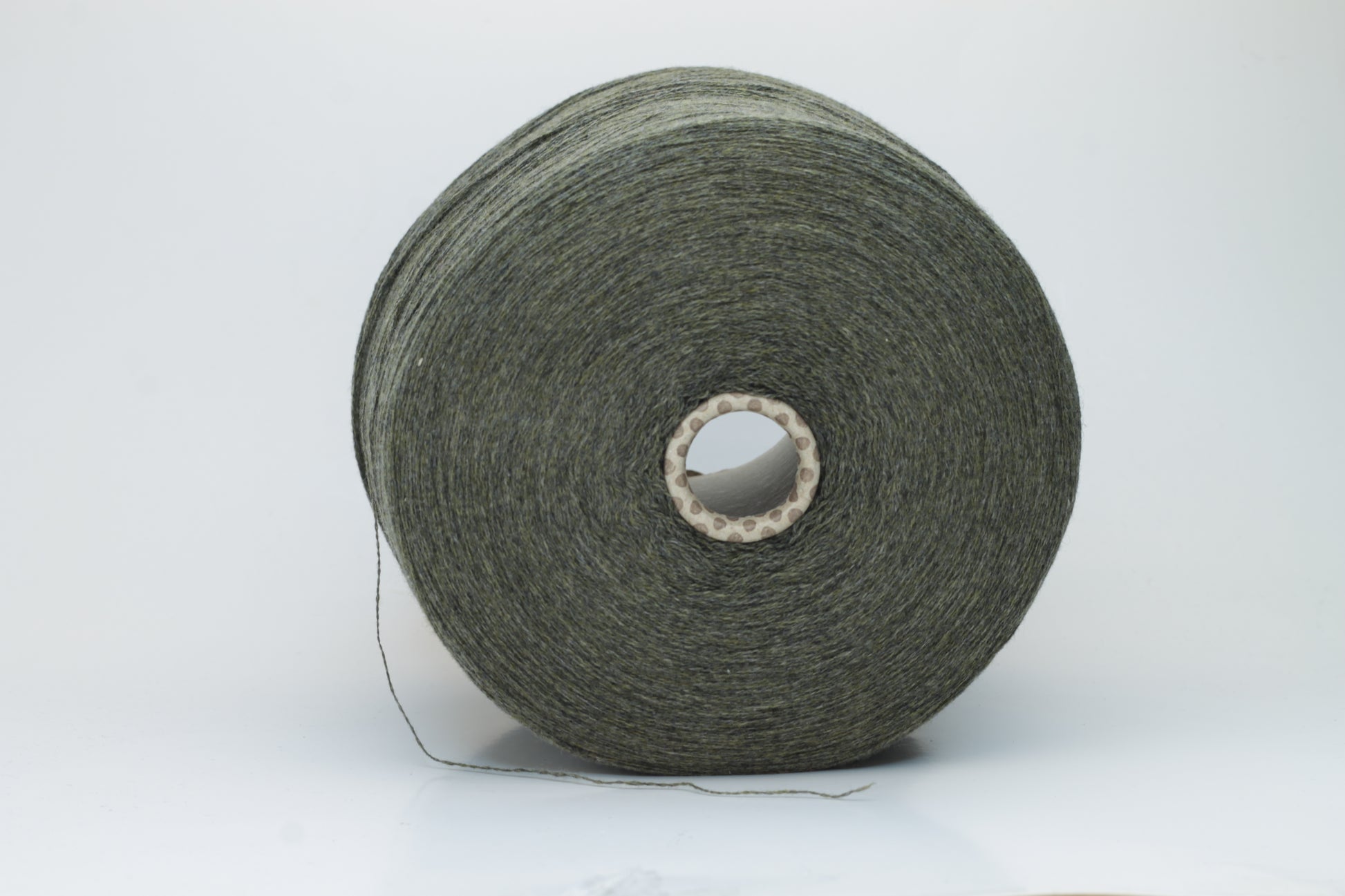 Close-up of a skein of luxurious 100% cashmere yarn in a deep Borneo brown, showcasing its soft, slightly matte sheen and subtle halo.