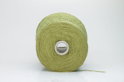 Close-up view of the Silk Bourette 100% yarn in Olive color, showcasing its exceptionally fine ply twist and soft sheen – a luxurious texture perfect for knitting or weaving.