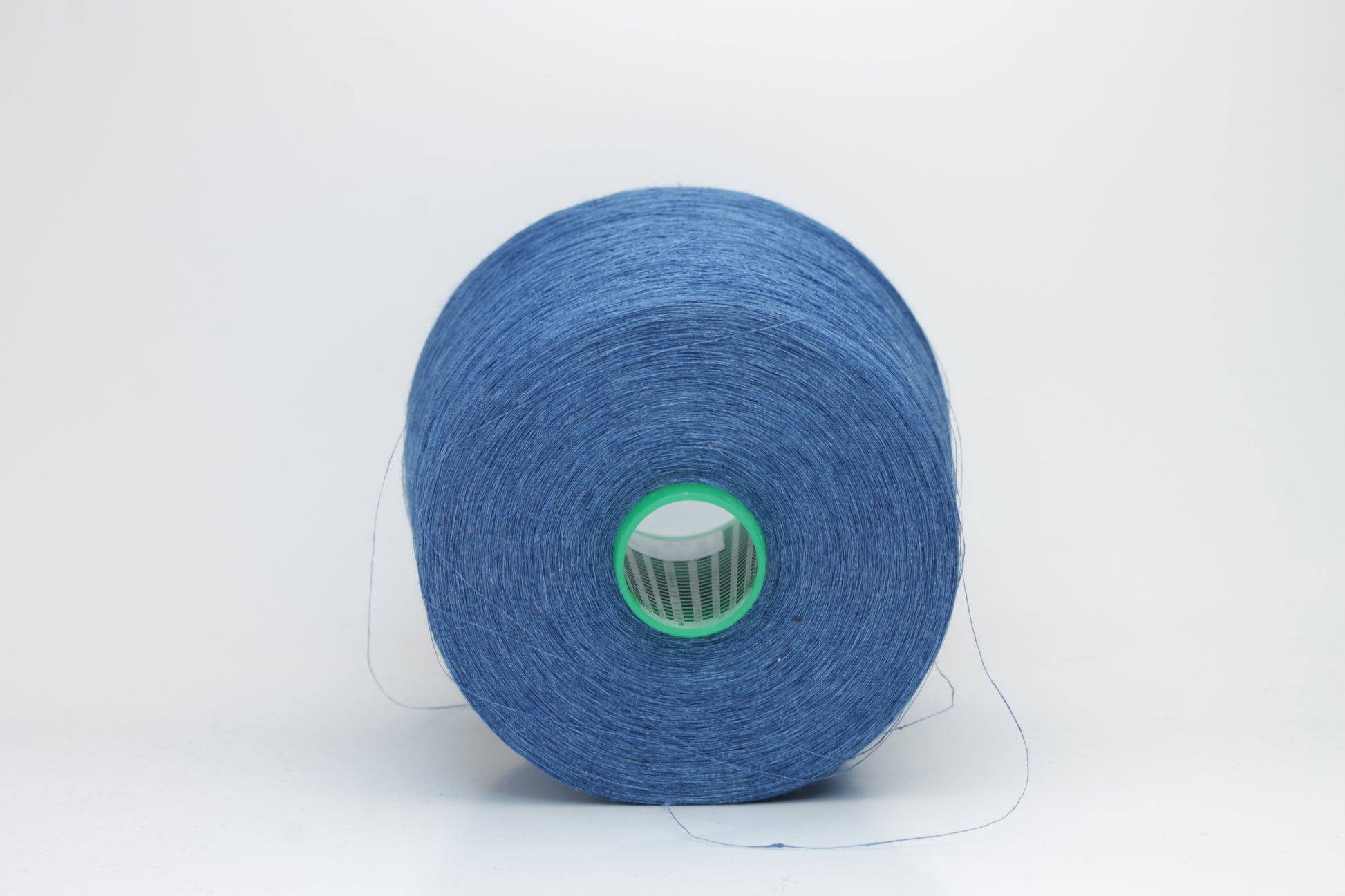 Fine, single-ply linen yarn in a rich Blue. Reveals a crisp texture and subtle natural sheen, typical of pure linen fiber.