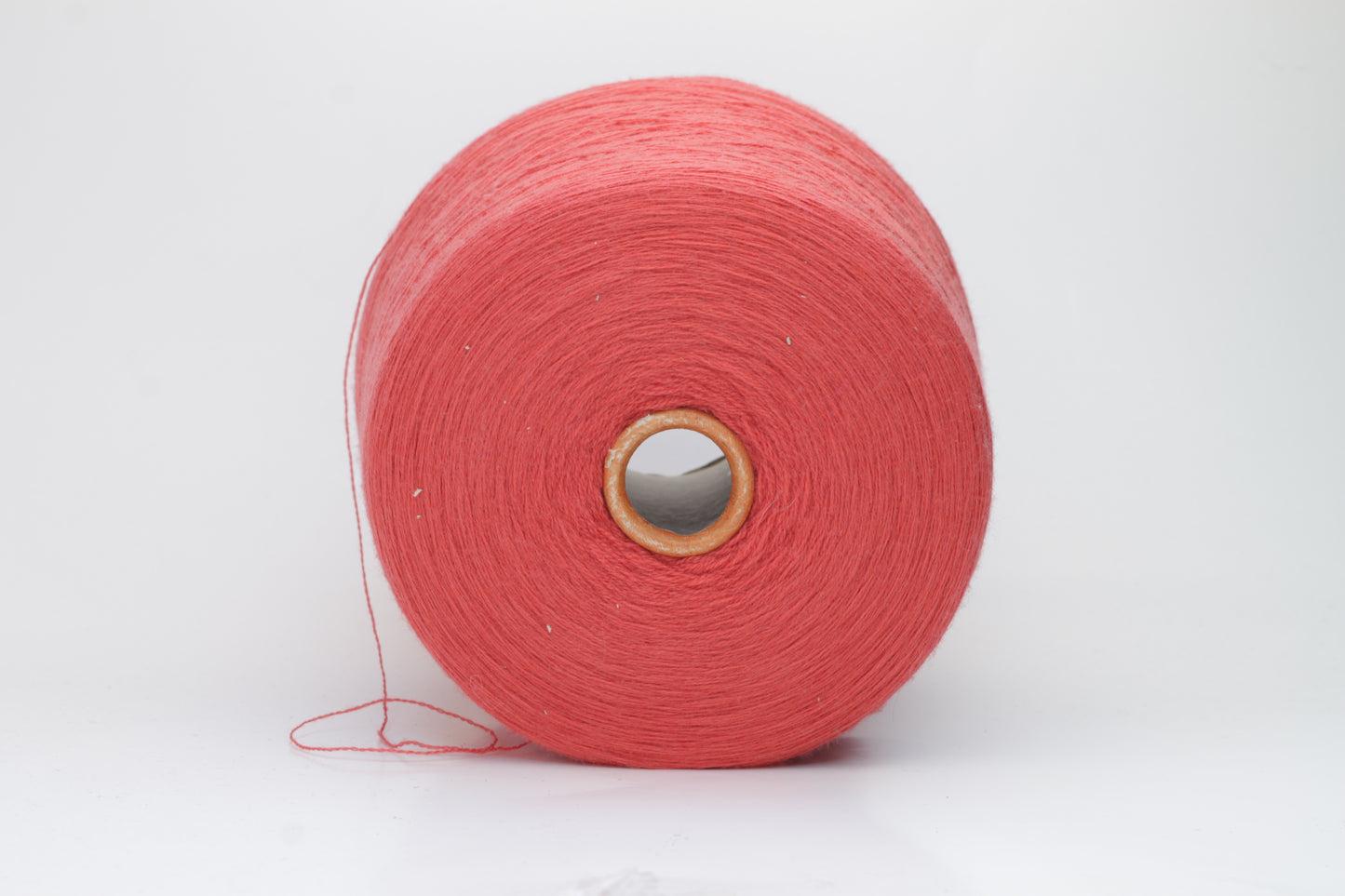 Close-up shot of vibrant red Zegna Baruffa Merino 100% Cashwool yarn, showcasing a tight 2/30 Nm ply twist and rich color depth, highlighting the wool's natural sheen and fluffy texture.