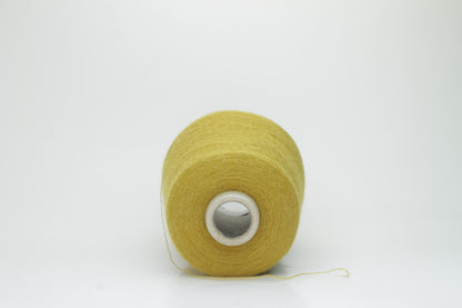Mustard 2-ply Alpaca Merino yarn, softly twisted with a gentle halo and subtle sheen, showcasing its deep, luxurious color saturation.