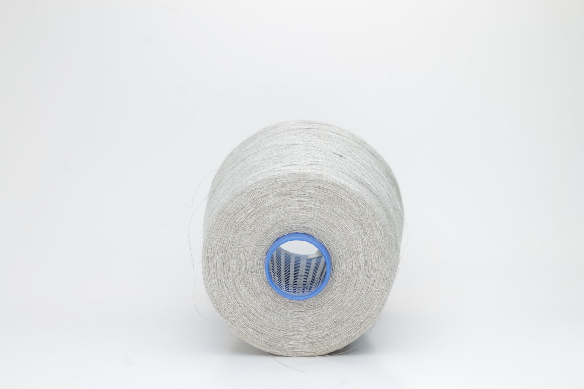 Fine, single-ply linen yarn in a rich charcoal gray. Reveals a crisp texture and subtle natural sheen, typical of pure linen fiber.