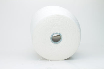 Close-up of a luxurious, soft skein of pale, milky blue cashmere yarn with a subtle sheen and light, even two-ply twist.