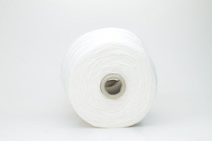 Close-up of pristine white linen and viscose blend yarn, softly twisted with a subtle sheen, showcasing its fine, smooth texture.