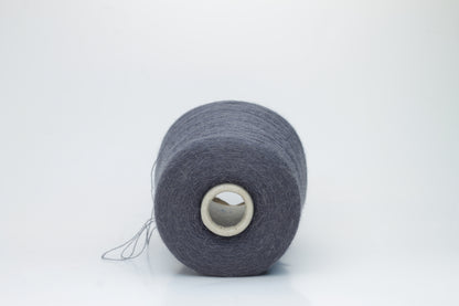 Rich Gray 2-ply Alpaca Merino yarn, softly twisted with a gentle halo and subtle sheen, showcasing its deep, luxurious color saturation.