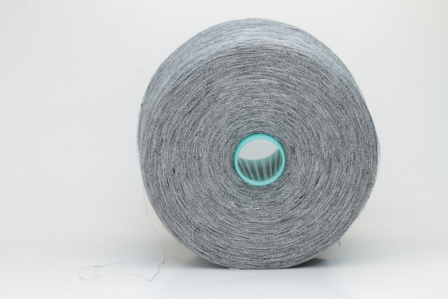 Fine, single-ply linen yarn in a rich Slate Blue-Gray. Reveals a crisp texture and subtle natural sheen, typical of pure linen fiber.