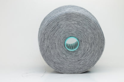 Fine, single-ply linen yarn in a rich Slate Blue-Gray. Reveals a crisp texture and subtle natural sheen, typical of pure linen fiber.