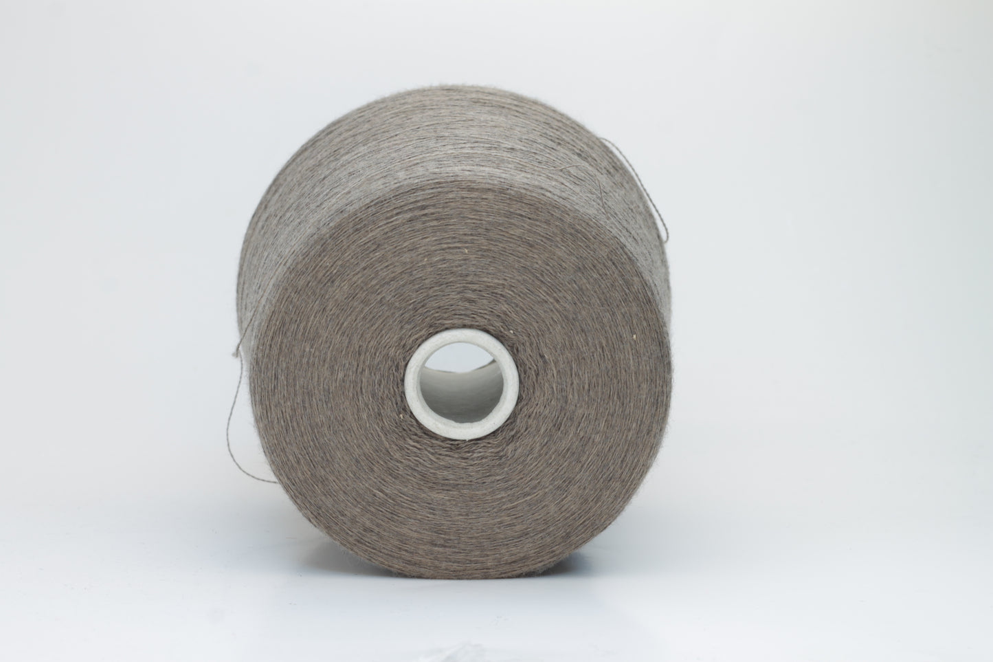 Close-up shot of Zegna Baruffa Merino 100% Cashwool Yarn in Taupe, showcasing a dense ply twist and fine thread structure with subtle sheen and a fluffy texture.