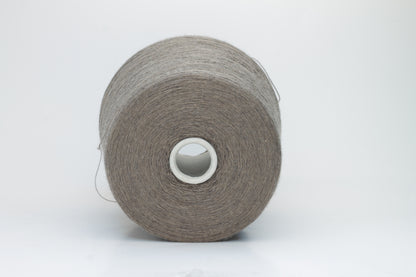 Close-up shot of Zegna Baruffa Merino 100% Cashwool Yarn in Taupe, showcasing a dense ply twist and fine thread structure with subtle sheen and a fluffy texture.