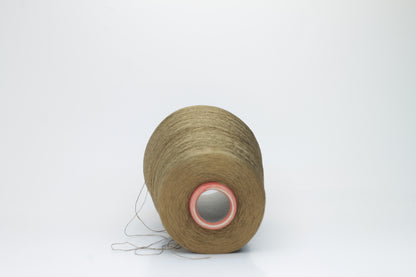 Close-up of a spool of finely twisted, single-ply Organzino silk yarn in a deep, lustrous bronze hue, catching light with a subtle, elegant sheen.
