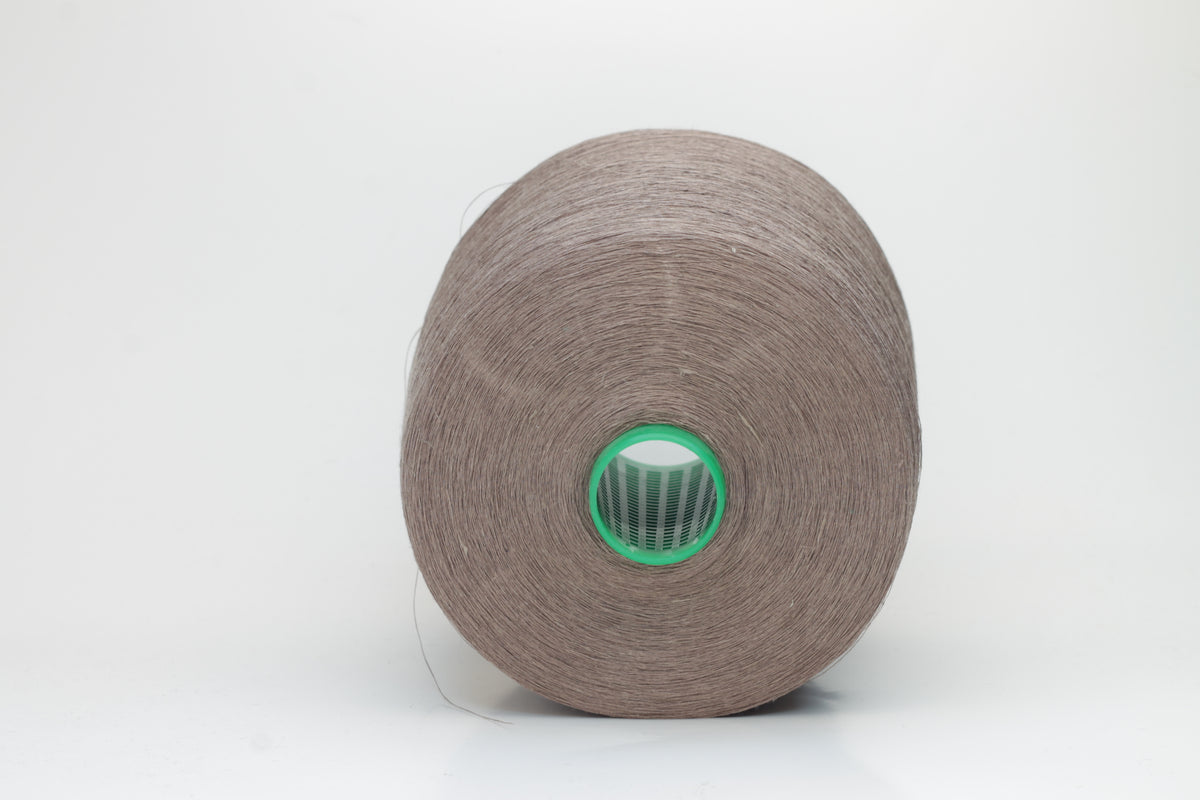Fine, single-ply linen yarn in a rich Talpa. Reveals a crisp texture and subtle natural sheen, typical of pure linen fiber.