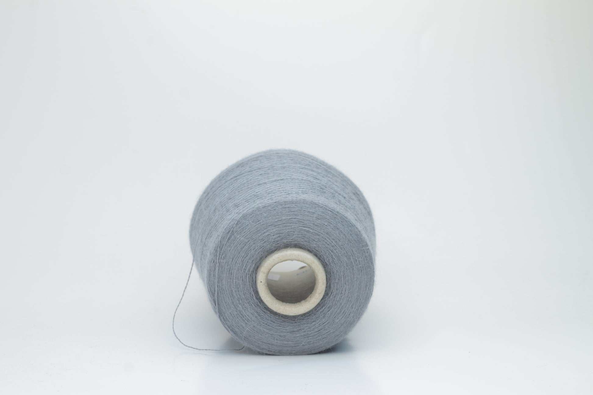 Denim Blue 2-ply Alpaca Merino yarn, softly twisted with a gentle halo and subtle sheen, showcasing its deep, luxurious color saturation.