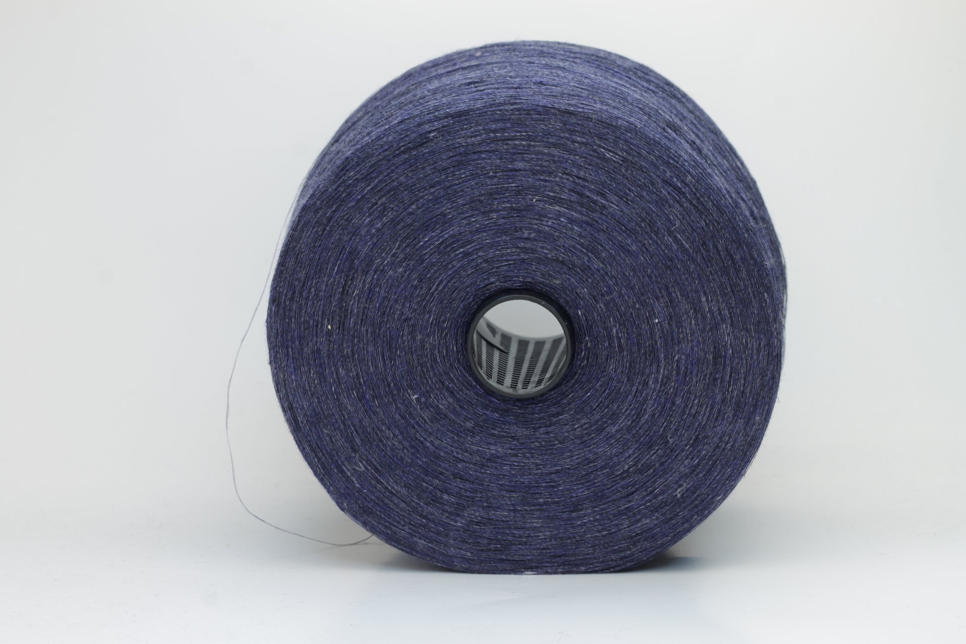 Fine, single-ply linen yarn in a rich Navy Blue. Reveals a crisp texture and subtle natural sheen, typical of pure linen fiber.