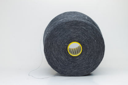 Fine, single-ply linen yarn in a rich Storm Gray. Reveals a crisp texture and subtle natural sheen, typical of pure linen fiber.