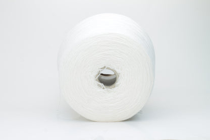 Close-up of a pure white cashmere yarn skein, showcasing its soft, slightly fluffy texture and subtle sheen with a gently twisted, fine two-ply structure.