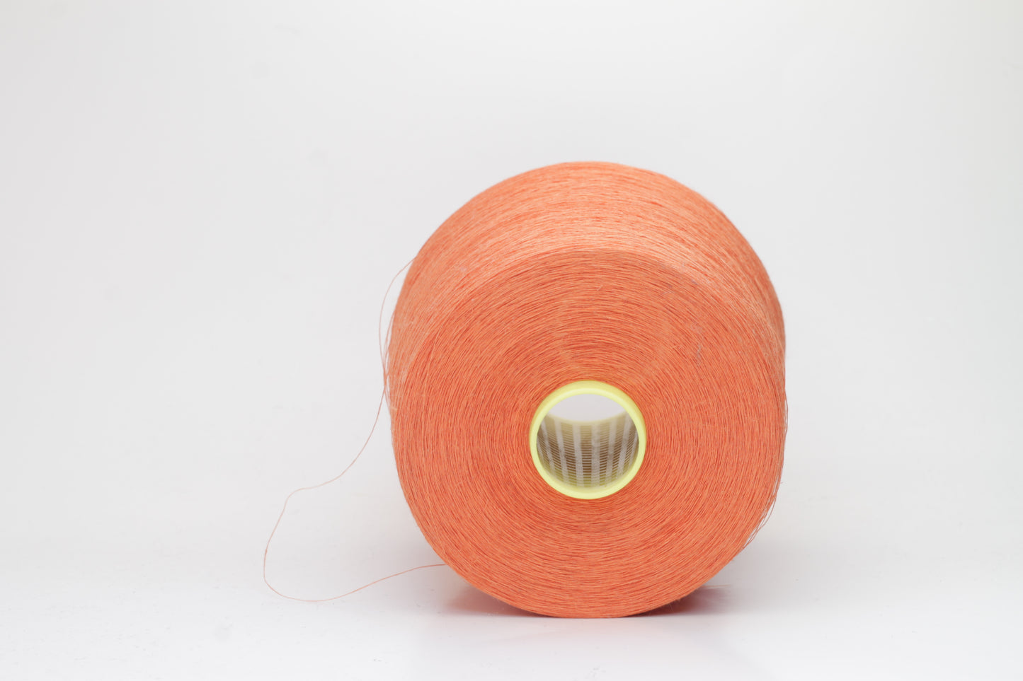 Fine, single-ply linen yarn in a rich Orange. Reveals a crisp texture and subtle natural sheen, typical of pure linen fiber.